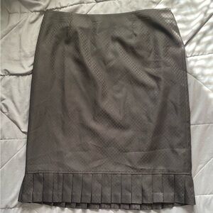 black pencil skirt with pleats on bottom. perfect for workplace, funeral, etc